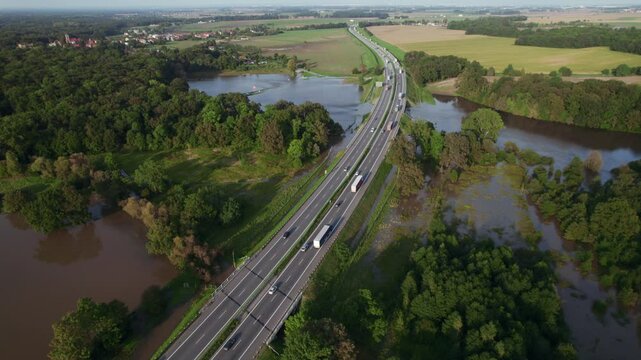 Katy Wroclawskie, Lower Silesia, Poland - September 19 2024: Aerial view of rising rivers threaten southern Poland near Wroclaw, A4 Autostrada Highway, Bystzryca river floods roads and villages
