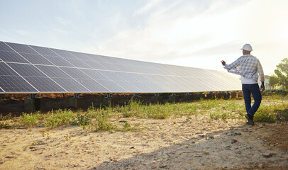 Back, man and solar panel in renewable energy for ecology, sustainable and clean power. Engineer,...