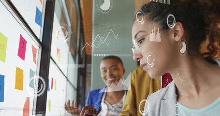 Image of financial data processing over diverse business people in office