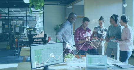 Business data analytics image over diverse team collaborating in modern office