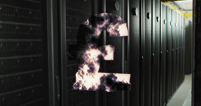 Pound sterling symbol with smoke effect image over server racks in data center