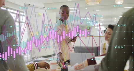 Image of financial data processing over diverse colleagues having meeting in office