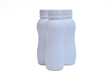 White plastic bottle with cap on a white background.