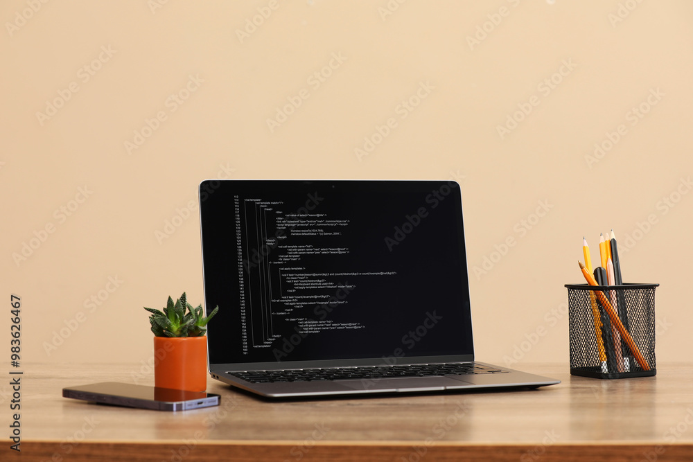 Aufkleber programmer's workplace. modern laptop with unfinished code on desk