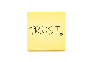 Hand writing Text TRUST on yellow sticky note with Clipping path isolate on white background....