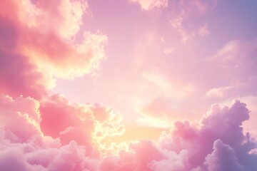 Fototapeta premium Morning sunrise illuminating a soft pink sky with yellow tones and fluffy clouds