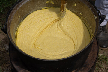 Balmos mamaliga is boiled, in jintita (or jintuial), with butter and sheep cream. Specialty in Romania, Ardeal, Bistrita 2024