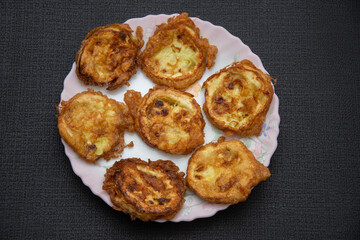 Plate with fried pumpkin slices with egg, Romania 2024