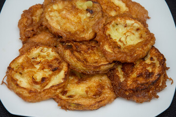 Plate with fried pumpkin slices with egg, Romania 2024