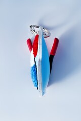 A colorful keychain featuring a stylized design, including red, white, and blue elements.