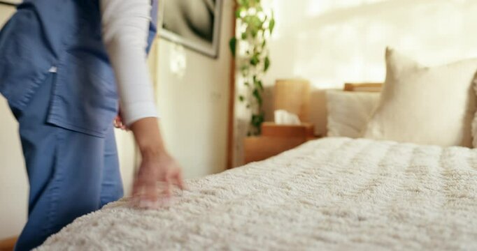 Nurse, woman and cleaning bed for housekeeping in retirement home with change sheets and hygiene. Assisted living, caregiver and hands fix pillows in bedroom for maintenance, assistance or housework