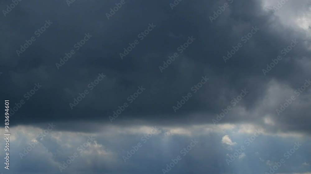 Poster movement of dark clouds in the sky. time lapse footage of dark clouds. dark clouds move slowly towar