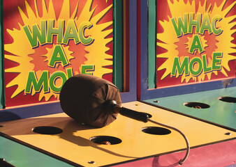 Classic Whac a Mole game at a carnival.