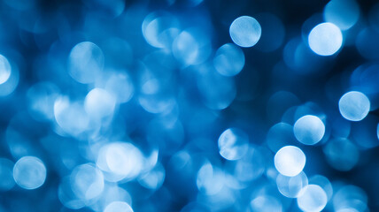 Abstract blue bokeh background with soft, blurred circles creating a calming atmosphere
