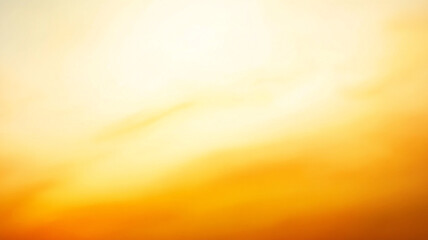 Fototapeta premium Golden sunset over a tranquil landscape with soft clouds during the evening sky