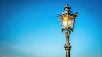 Vintage pole street light against a clear blue sky , vintage, pole, street light, lamp, retro, antique, classic