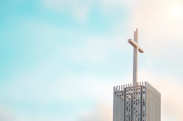 The crucifix symbol of Jesus on the blue sky background