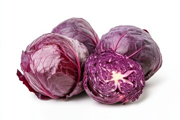 Obraz premium Red cabbage, whole and sliced, isolated on white background. Fresh, vibrant, and ready for your next recipe. Perfect for salads, stews, and sauerkraut.