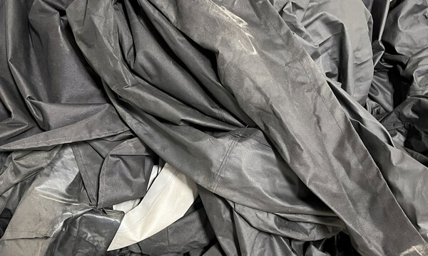 A  large crumpled black tarp