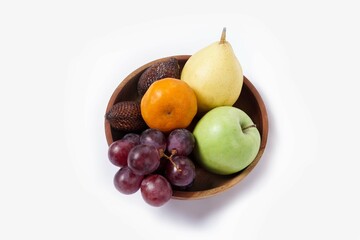 Assortment of exotic fruits isolated on white background. Close up of heap of fruit. Concept of healthy eating and dieting lifestyle. 