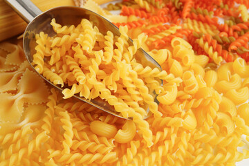 Pasta noodles for cooking Italian food in plastic bag on white background.