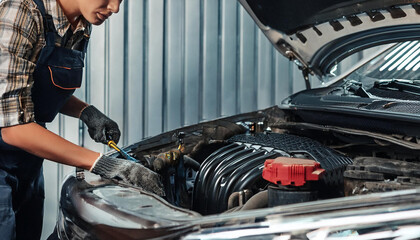 Fototapeta premium mechanic repair the engine of car