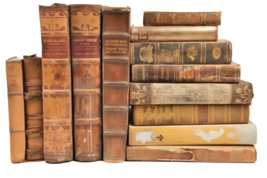 A collection of well-worn vintage books stacked neatly on a surface, showcasing intricate bindings and varied colors in a cozy reading corner