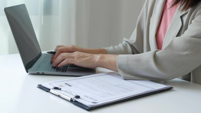 Business woman employer holds resume and talks with job applicant for job interview about her career and personal history in company, recruitment concept.

