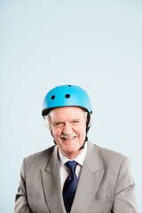 Studio, business man and portrait, bicycle helmet and protection, safety or reduce risk of head injury. Mature, thoughts and ideas with gear by white background for travel, commute and mockup space