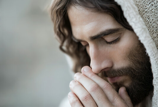 Nahaufnahme von Jesus Christus im Gebet, in einem Moment der spirituellen Besinnung und inneren Ruhe, symbolisierend Glaube, Hoffnung und Demut