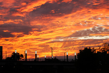 Fototapeta premium cloudy sky and sunset colourful and silhouette of city and light
