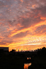 cloudy sky and sunset colourful and silhouette of city and light