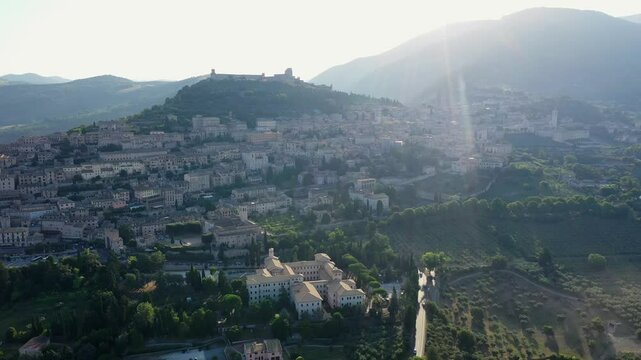 Aerial view of the historical tourist center, Church of Santa Maria sopra Minerva in Assisi, Piazza del Comune in Assisi on a summer sunrise, Perugia, Italy, Europe