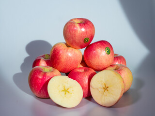 Fresh Red Apples on a Light Background