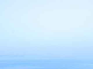 Obraz premium Serene Blue Horizon with Calm Water Surface