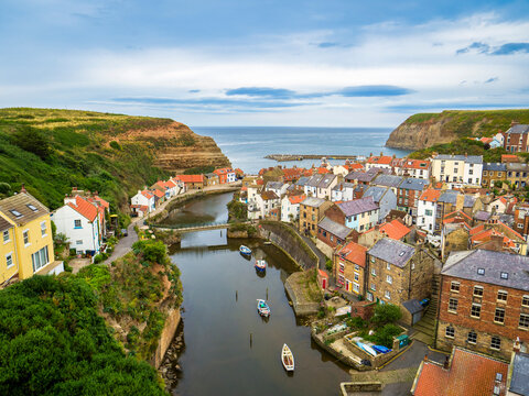 Staithes - the North Yorkshire village of Staithes on a summer evening at high tide.