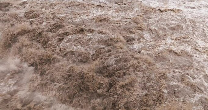 close up of flood water flowing in the river