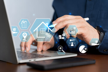 Real estate investment concept. Man use laptop with house icon for analyzing mortgage loan home