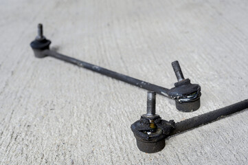 Close-up of worn out car front stabilizer sway bar link.