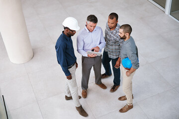 Architecture, construction and business people with tablet for digital blueprint, building planning...
