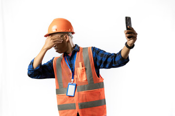 Asian adult male construction worker who looks very angry while on a video call while carrying a clipboard report, industrial and construction concept, isolated white background.