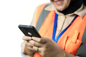 Portrait of young woman construction worker wearing safety vest, construction and industrial work concept, isolated on white background.
