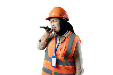 Young Asian female construction worker in hijab who looks very angry while on a voice call, industrial and construction concept, isolated white background.
