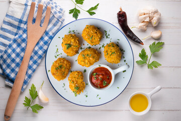 Homemade chicken nuggets with tomato sauce. Top view table with decoration.