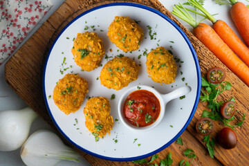 Homemade chicken nuggets with tomato sauce. Top view table with decoration.