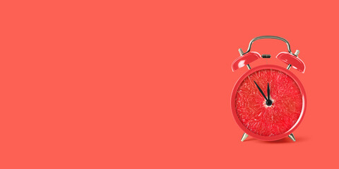 Juicy grapefruit on alarm clock dial against red background. Creative poster with space for text, banner design
