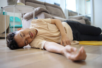 Young Asian Man Fainted on The Floor at Home
