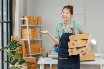 Small Business, Big Smiles: Young entrepreneur revels in success amidst a flurry of packages in her...