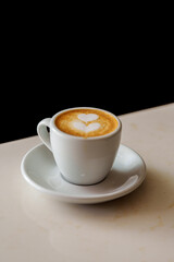 cup of coffee on black background macchiato