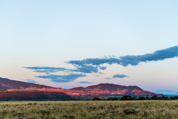red illumintated mountains at sunrise